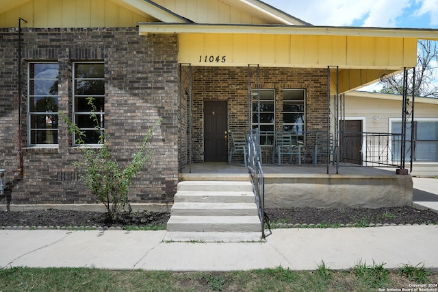 entrance to property with covered porch