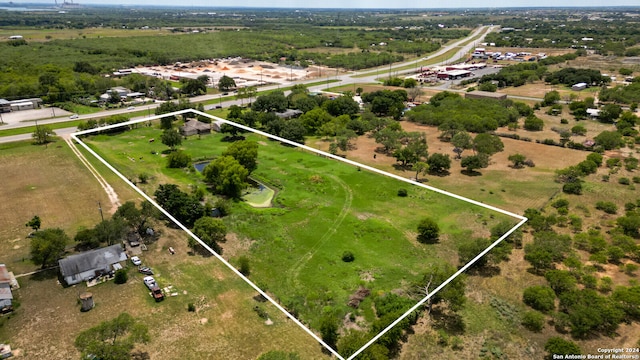 birds eye view of property with a rural view