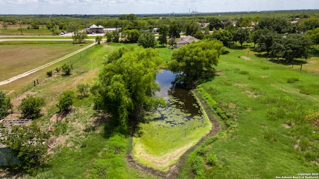 bird's eye view with a water view and a rural view