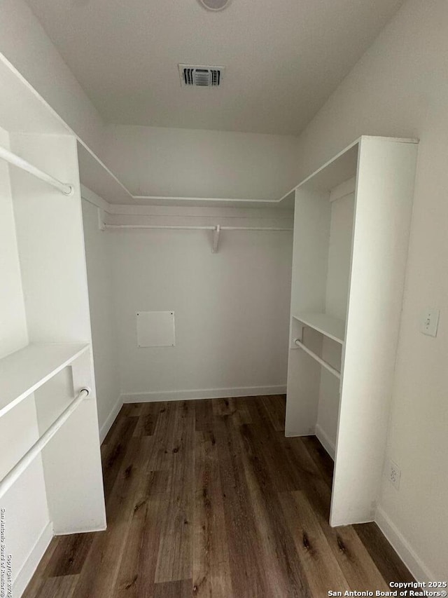 spacious closet with visible vents and wood finished floors