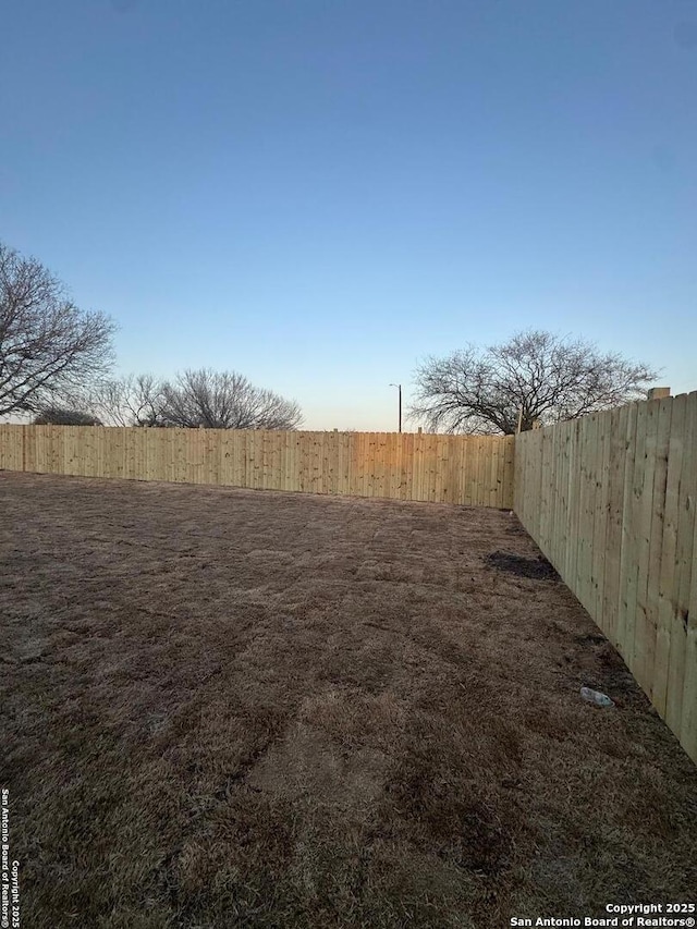 view of yard featuring a fenced backyard