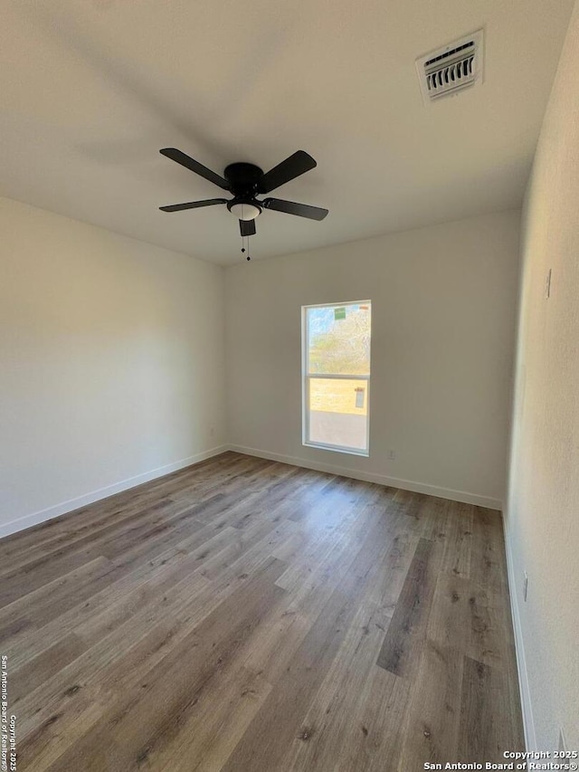 unfurnished room with ceiling fan and light hardwood / wood-style floors