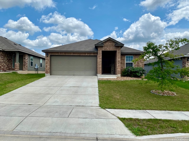 view of front of property with a garage and a front yard