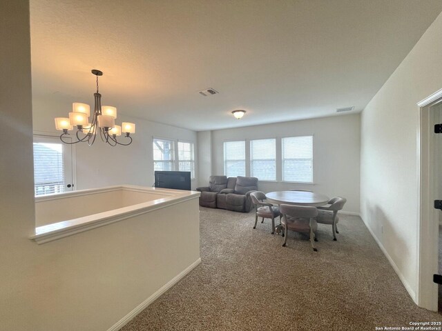 living room featuring carpet flooring and ceiling fan