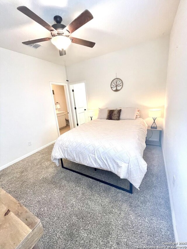 bedroom with carpet flooring, a closet, a spacious closet, and ceiling fan