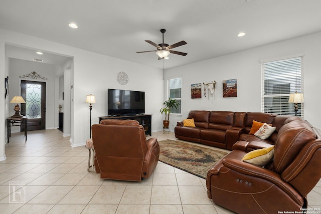 tiled living room featuring ceiling fan