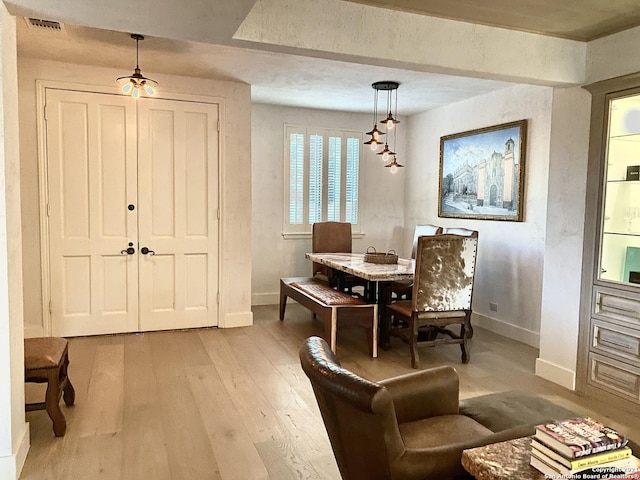 dining room with light hardwood / wood-style floors