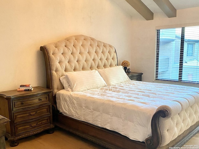 bedroom featuring beam ceiling