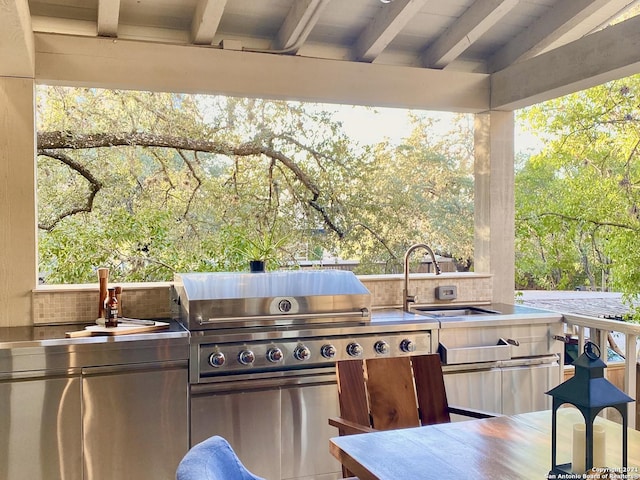 view of patio featuring area for grilling, grilling area, and sink