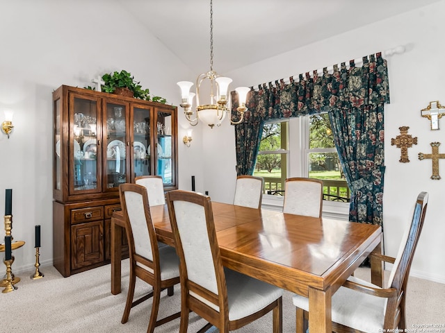 carpeted dining room featuring a notable chandelier and high vaulted ceiling