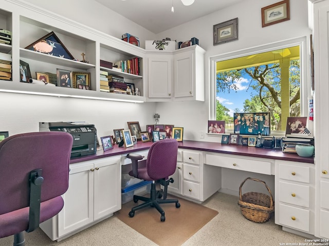 office space with light carpet and built in desk