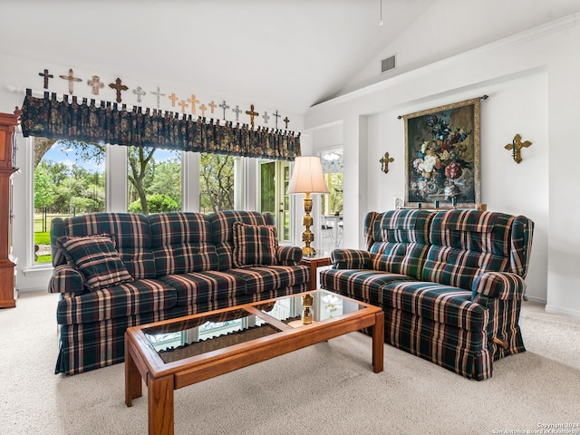 living room with light carpet and vaulted ceiling