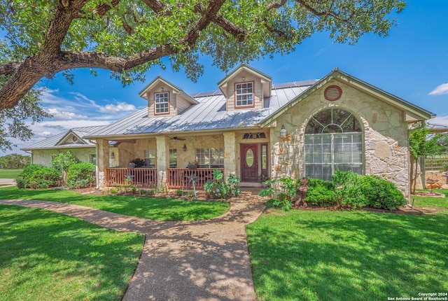 view of front of house featuring a porch and a front lawn