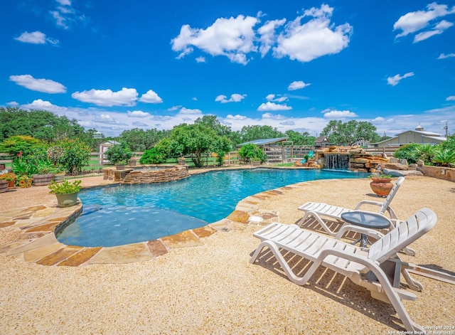 view of swimming pool with a patio