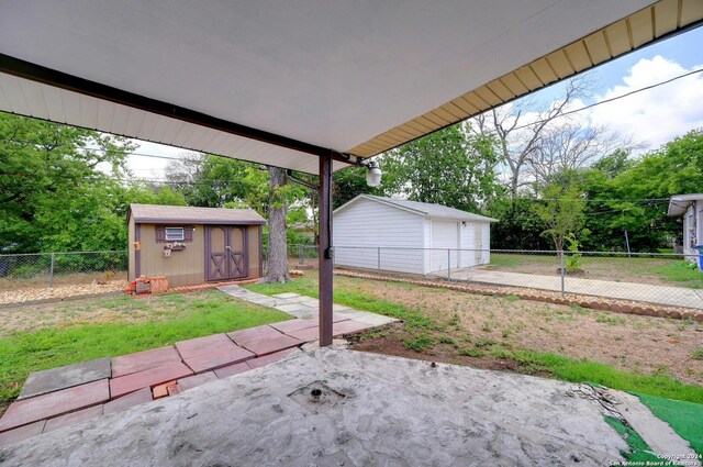 view of patio / terrace featuring a storage unit