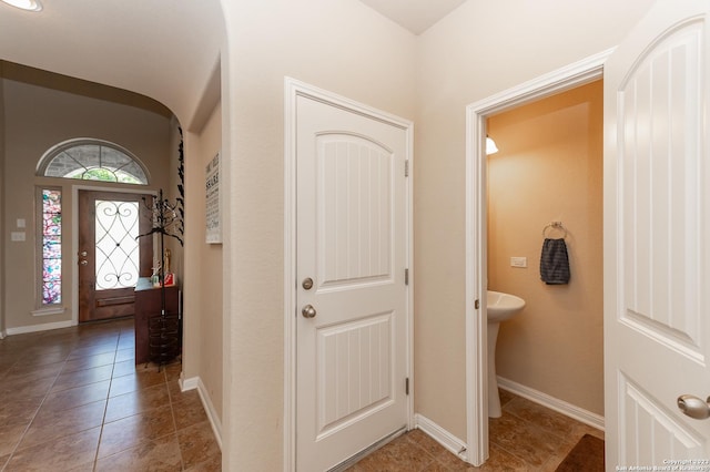 foyer entrance featuring tile patterned flooring