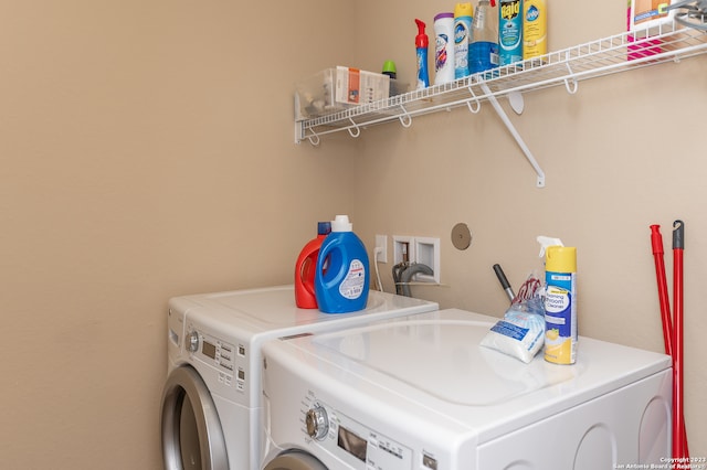 washroom with washing machine and dryer