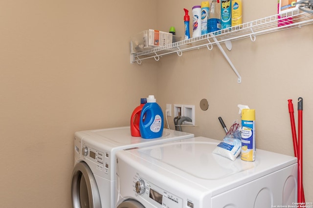 laundry room with washer and dryer