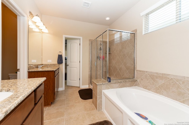 full bathroom with vanity, plus walk in shower, toilet, and tile patterned floors