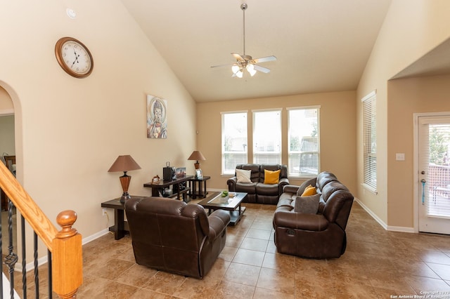 living room featuring high vaulted ceiling, ceiling fan, and light tile patterned floors