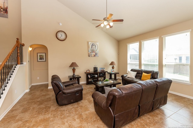 living room featuring high vaulted ceiling, ceiling fan, and light tile patterned floors