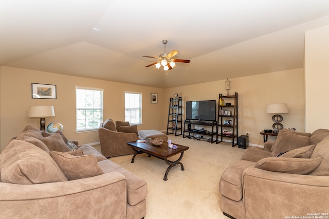 carpeted living room featuring vaulted ceiling and ceiling fan