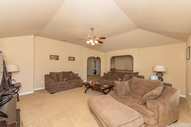 living room featuring ceiling fan, vaulted ceiling, and light carpet