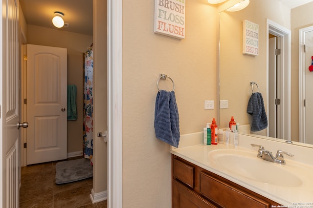 bathroom featuring tile patterned floors and vanity