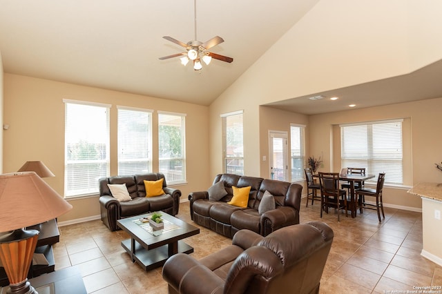 living room with ceiling fan, light tile patterned floors, and high vaulted ceiling