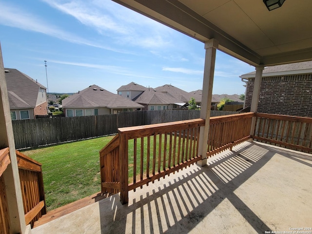 wooden terrace with a yard