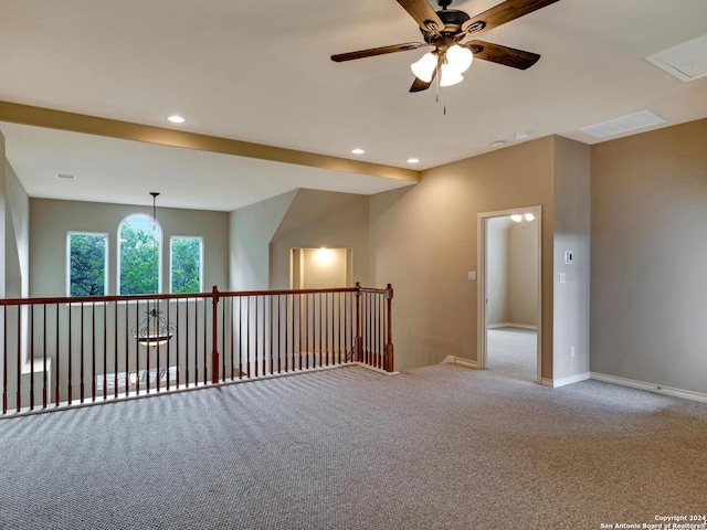 empty room featuring light carpet and ceiling fan