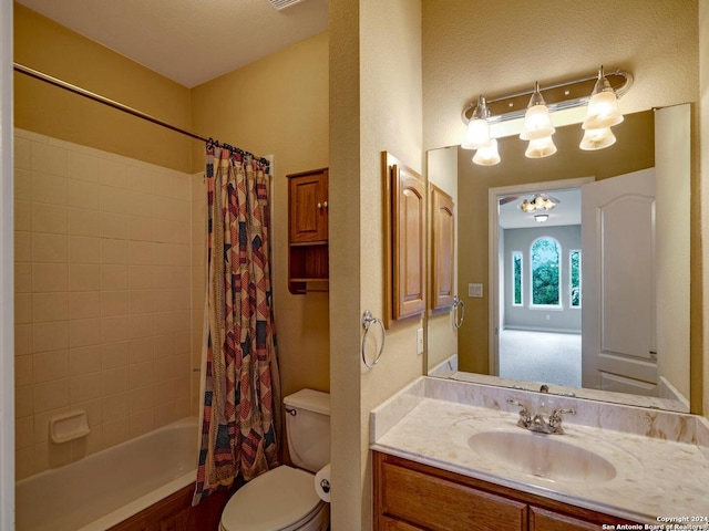 full bath with toilet, shower / bath combo with shower curtain, and vanity