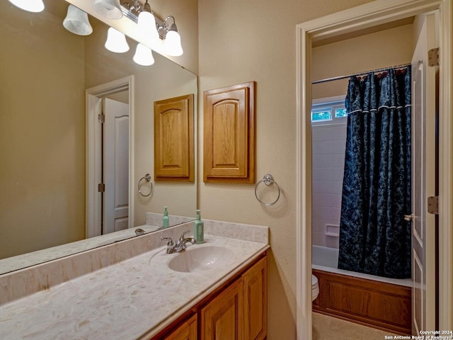 bathroom featuring toilet, shower / tub combo, and vanity