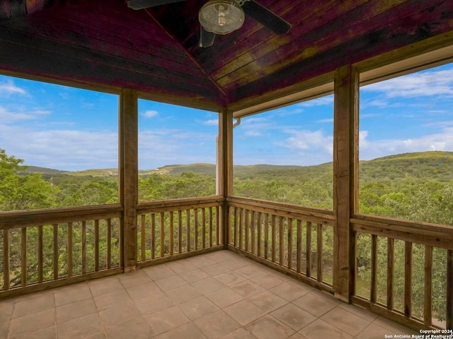 exterior space featuring a ceiling fan