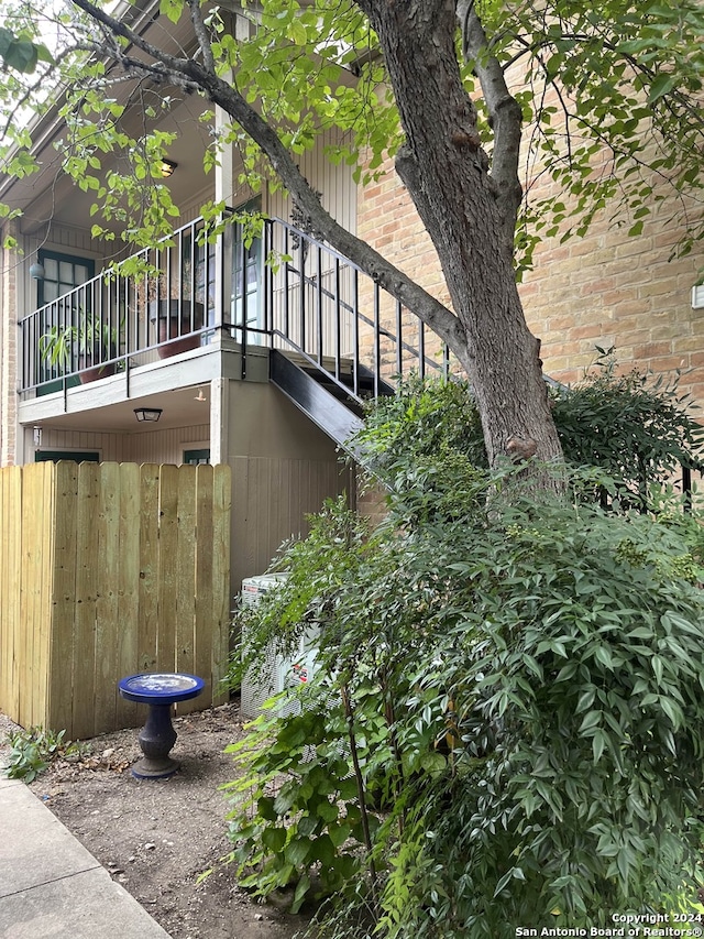 view of side of home with a balcony