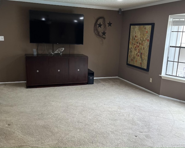 unfurnished living room featuring light colored carpet and ornamental molding