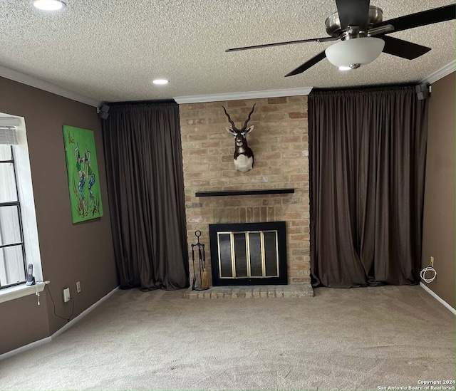 unfurnished living room featuring a textured ceiling, carpet floors, a brick fireplace, and ceiling fan