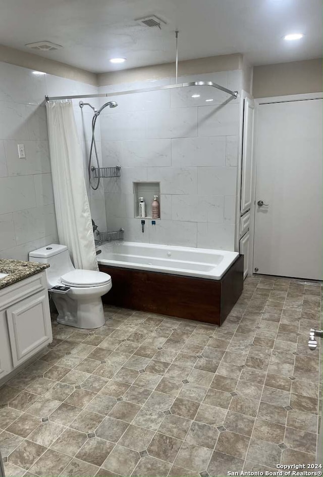 full bathroom featuring tile patterned flooring, toilet, vanity, and shower / tub combo with curtain