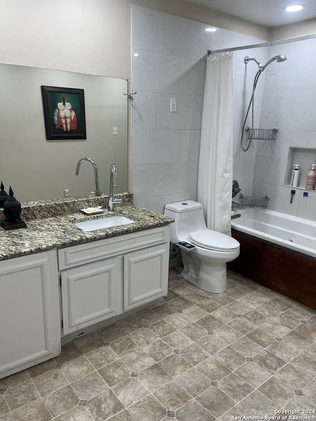 full bathroom featuring tile patterned floors, shower / bath combo, toilet, and vanity