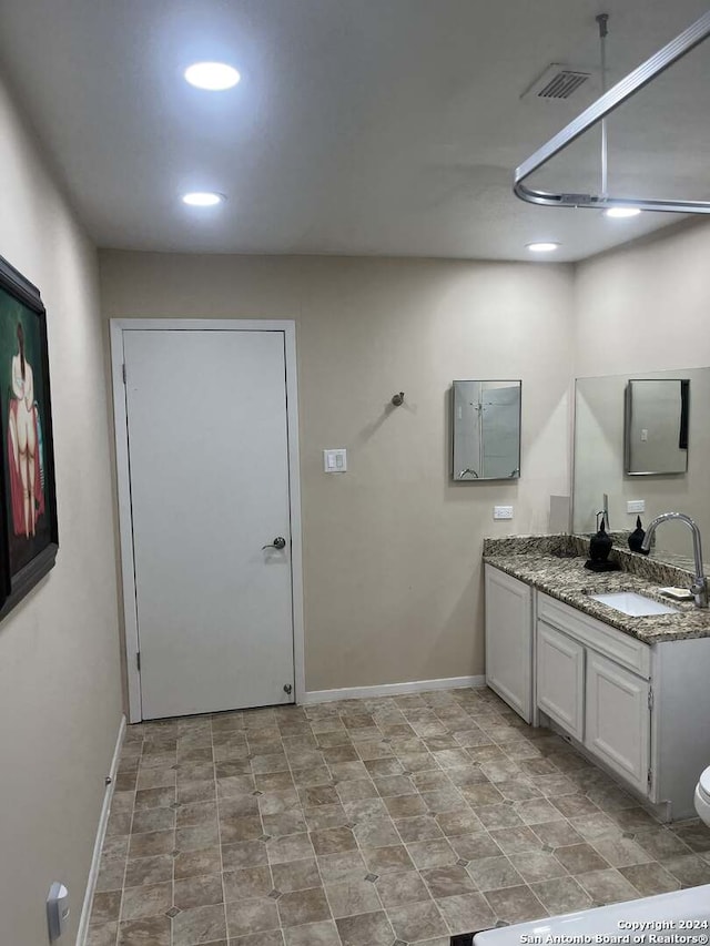 bathroom with tile patterned floors, toilet, and vanity