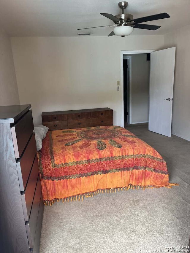 carpeted bedroom with ceiling fan