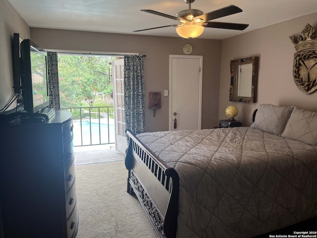 carpeted bedroom featuring access to outside and ceiling fan