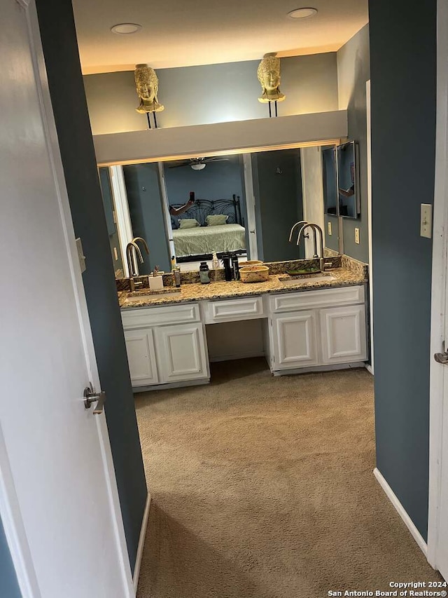 bathroom featuring double vanity