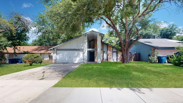 view of front of home featuring a garage and a front lawn