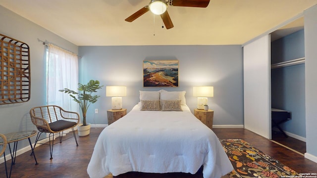 bedroom with dark hardwood / wood-style flooring and ceiling fan