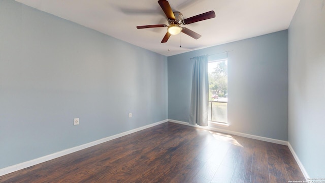 unfurnished room with dark wood-type flooring and ceiling fan