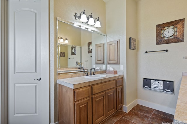 bathroom with tile patterned flooring and vanity