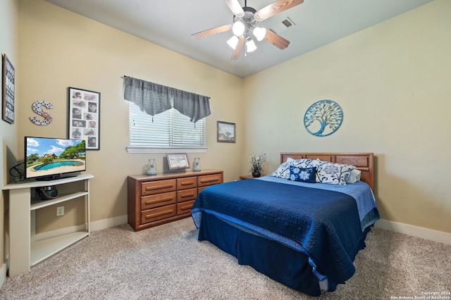 carpeted bedroom with ceiling fan