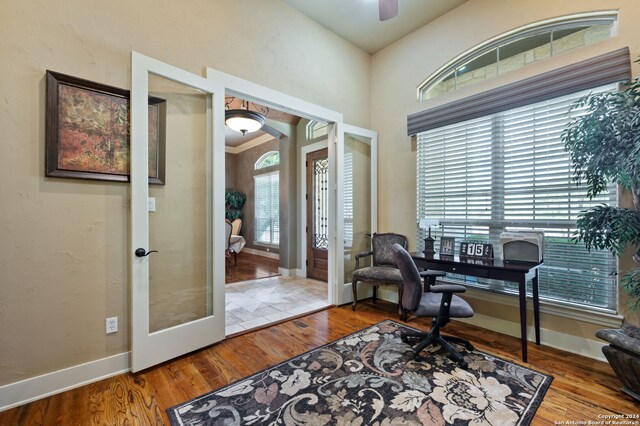 home office featuring french doors and wood-type flooring