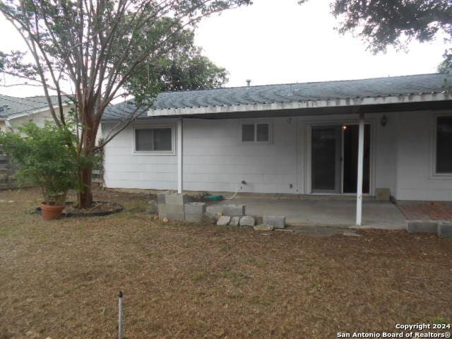 rear view of property featuring a patio area